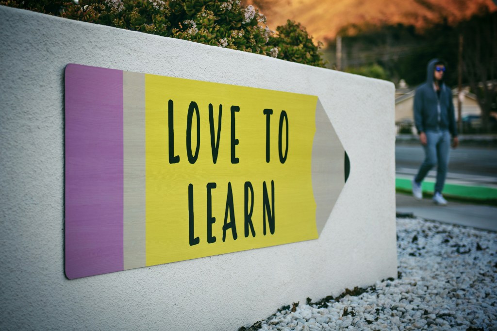 Pencil sign that reads "Love to Learn"